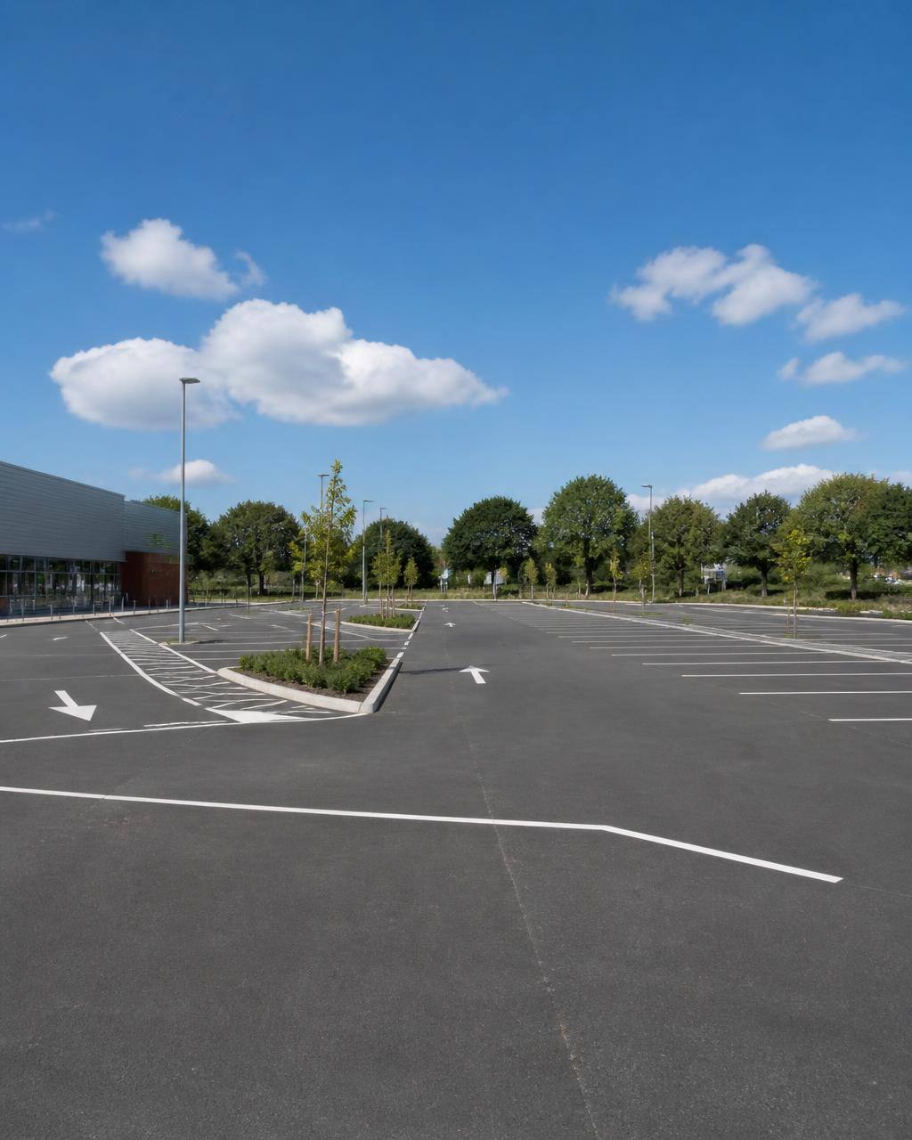Well-maintained UK commercial car park with clear line markings